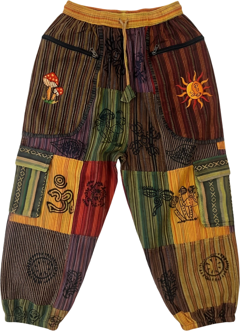 Buddha Eye — multi-stripe patchwork trousers printed with an om and the stupa eyes.