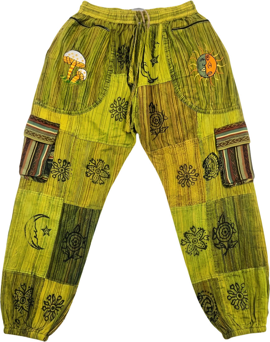 Monsoon Fern — lime and olive patchwork trousers with an embroidered mushroom and sun-moon face.